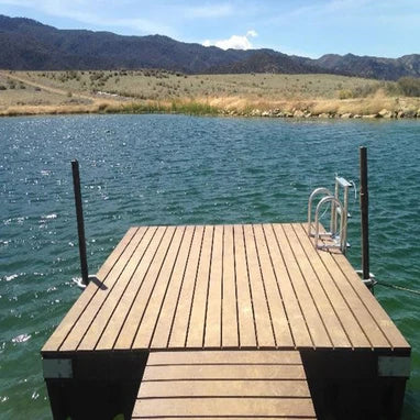Floating Dock extending into a lake with mountains in the background