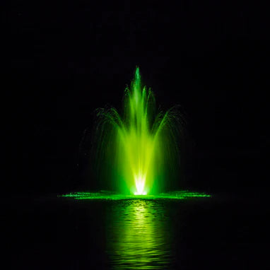 Power House Fountain in pond at night with green lighting