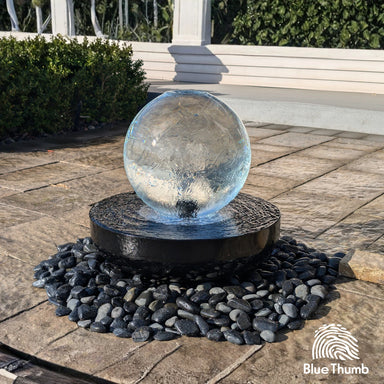 14 inch crystal sphere fountain in a black steel bowl with black pebbles