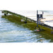 Bearon Weeds Away attached to dock in a body of water 
