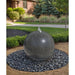 Blue Thumb 30 inch black granite sphere fountain installed in a landscape