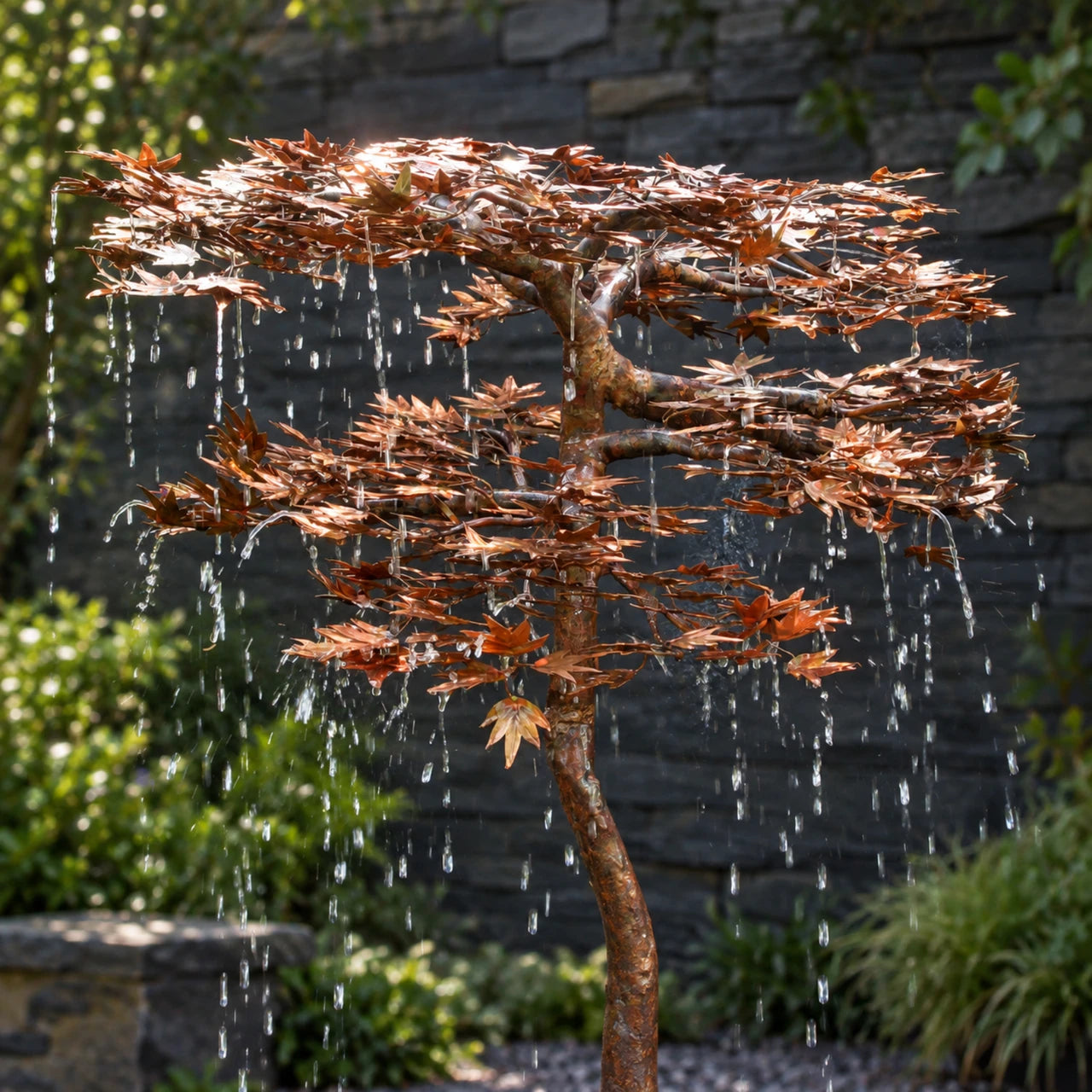 Close-up of hand-cut copper maple leaves with water droplets