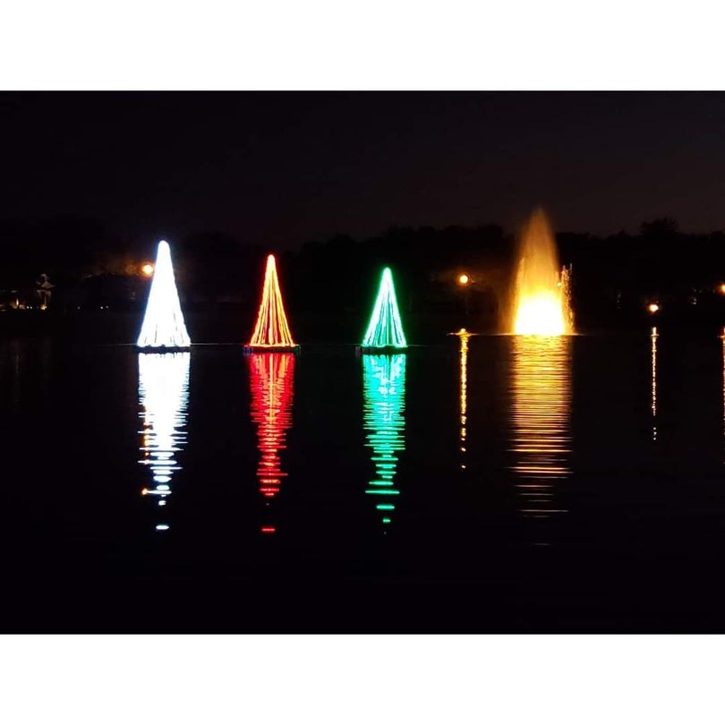 Vanguard Majestic Floating Christmas Trees lit up on a pond at night