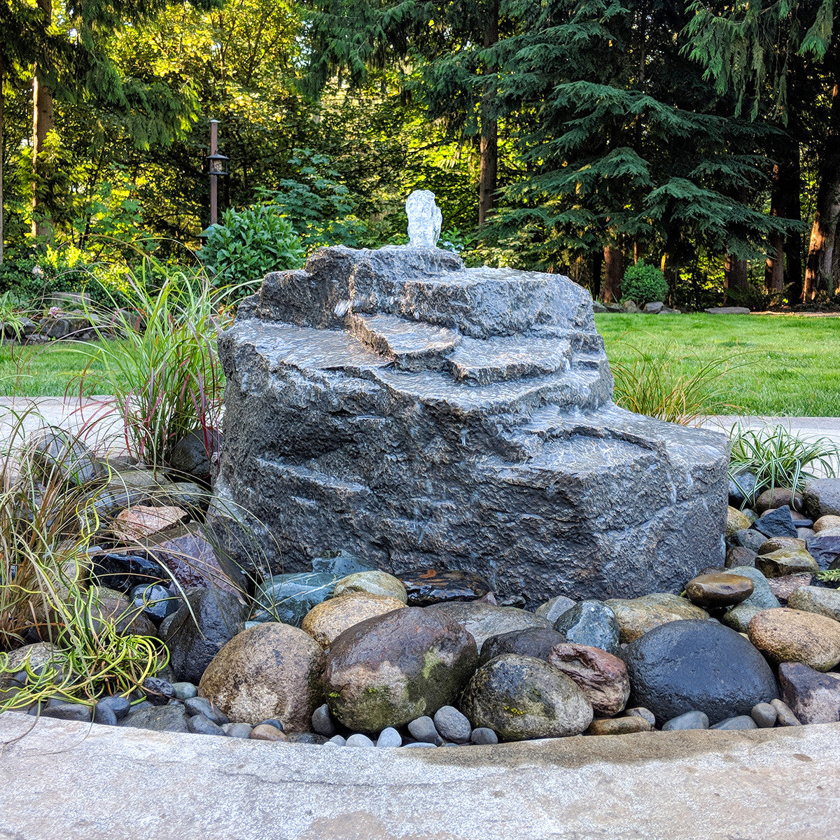 Mountain Spring rock fountain installed in a garden