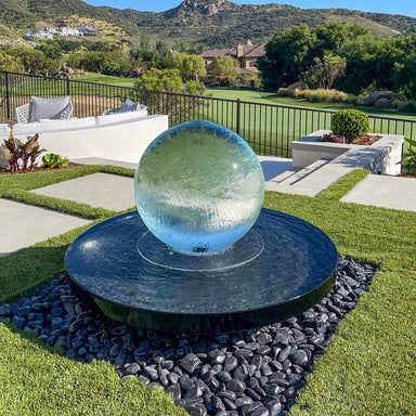 Blue Thumb 24 inch crystal acrylic sphere fountain kit in a landscape