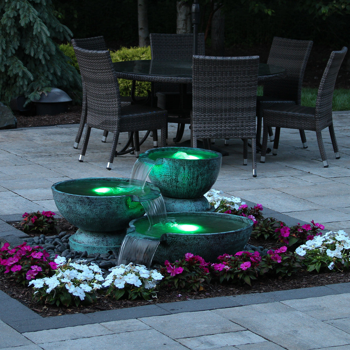 Triple spillway bowl fountain lit at night