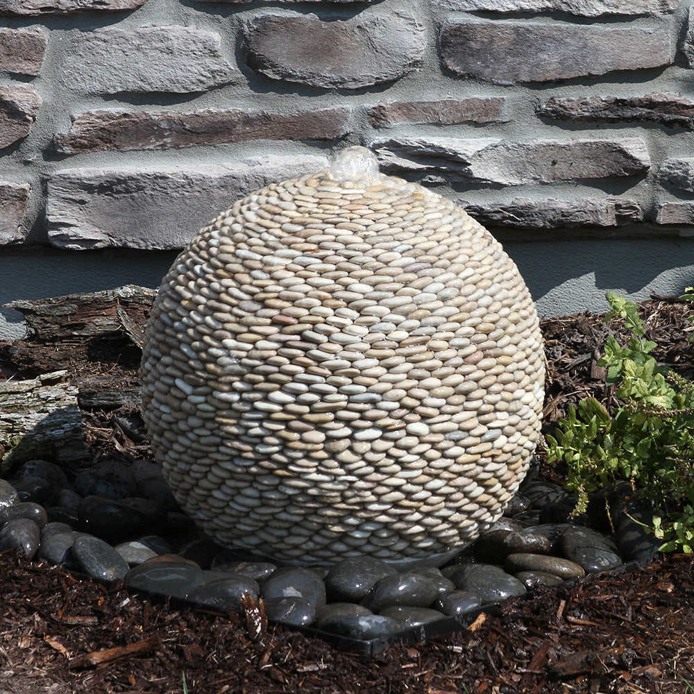Tan pebbled sphere fountain