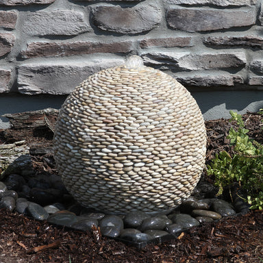 Tan pebbled sphere fountain