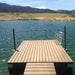 Floating Dock extending into a lake with mountains in the background