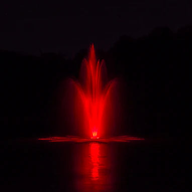 Power House Fountain in pond at night with red lighting