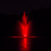 Power House Fountain in pond at night with red lighting