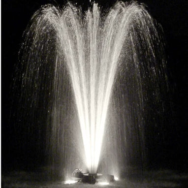 Power House Fountain in pond at night with white lighting