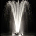Power House Fountain in pond at night with white lighting