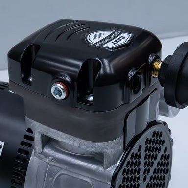 Close-up of Stratus™ SRC 1/4hp Compressor with Sound Shield with a visible brand logo on a gray background