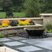 Blue Thumb 28 inch powder-coated cast iron sugar kettle fountain installed in a landscape