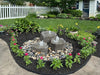 Blue Thumb Triple Falls GFRC boulder fountain kit in a landscaped yard