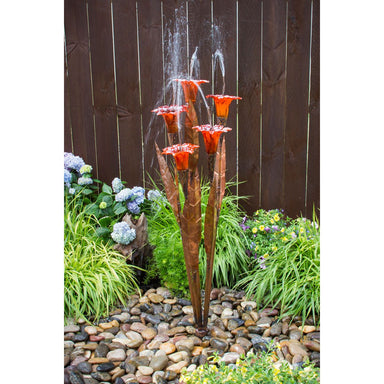 Blue Thumb copper fountain with orange glass trumpet flowers