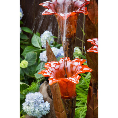 Orange glass trumpet copper flower fountain detail