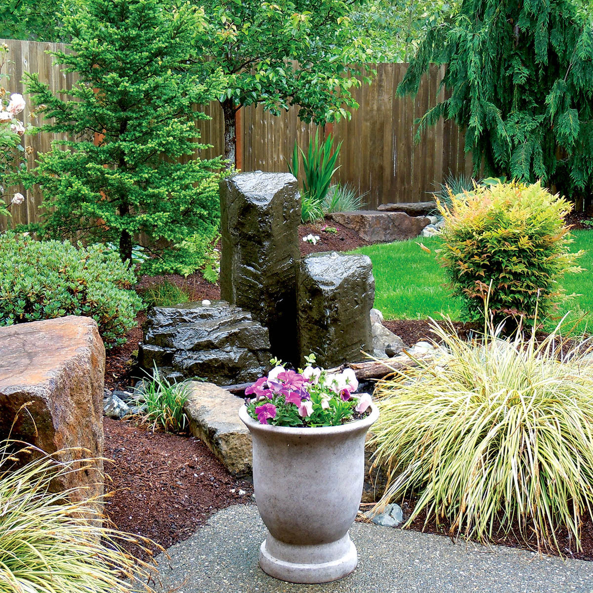 Cascade Mini Mountain Spring triple fountain installed in a garden