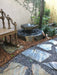 Bird visiting a basalt bird bath fountain