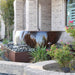 Blue Thumb 33 inch sugar kettle fountain in a backyard